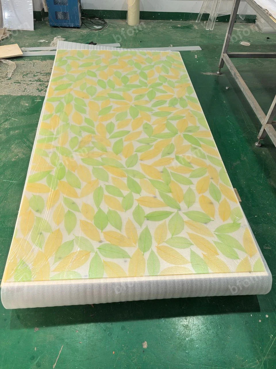 Decorative resin sheet laid out for visual inspection